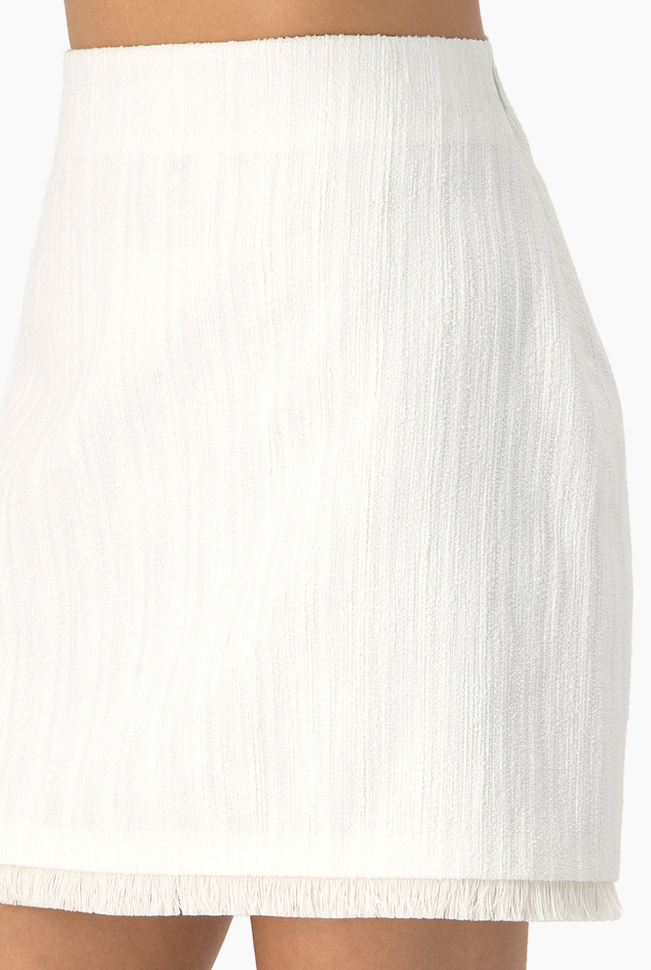 Falda tejida corta con flecos